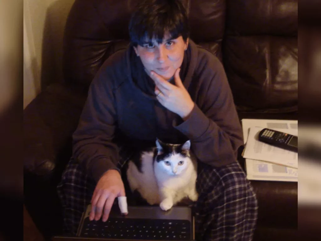 cat and human in similar poses doing math