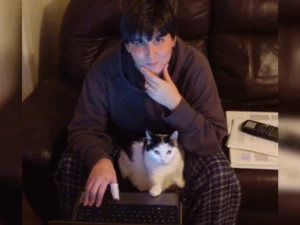 cat and human in similar poses doing math
